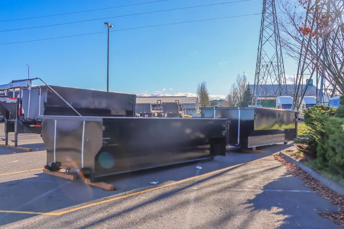 Roll-off dumpster ready for waste disposal at job site for Construction Dumpster Rental in Westbury